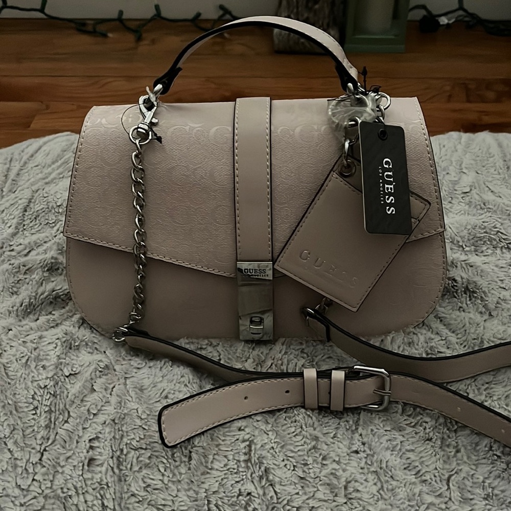 An amazing beautiful guess purse brand new with the tags.